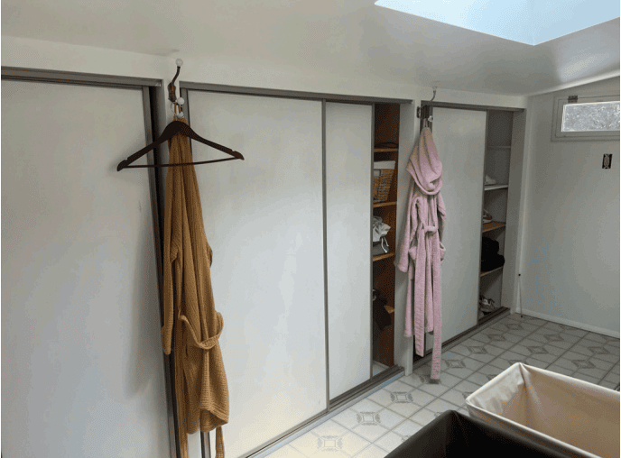Before the renovation ~ the original closet wall with sliding doors in the unpermitted Hollywood Hills bathroom addition.