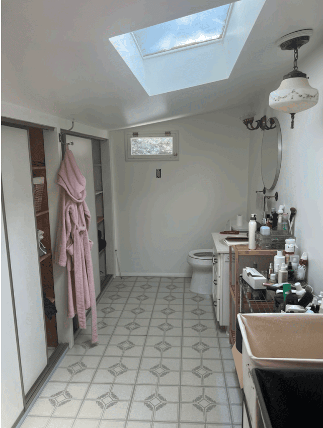 Before the renovation ~ the low ceiling and skylight in the original Hollywood Hills primary bathroom, later replaced with a raised roof and clerestory windows.